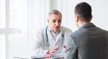 a man in a meeting with a specialist